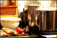 A kitchen with a meal in the midst of being prepared